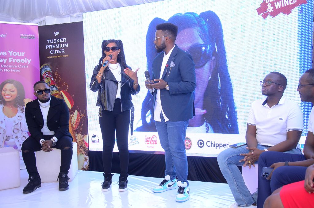 Spice Diana addresses the media as Cosign L and the sponsors R look on