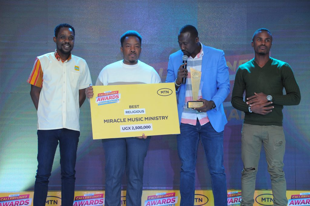 MTNs Onyait Odeke L handed over the Best gospel MTN CallerTunez award to Miracle Music Ministry