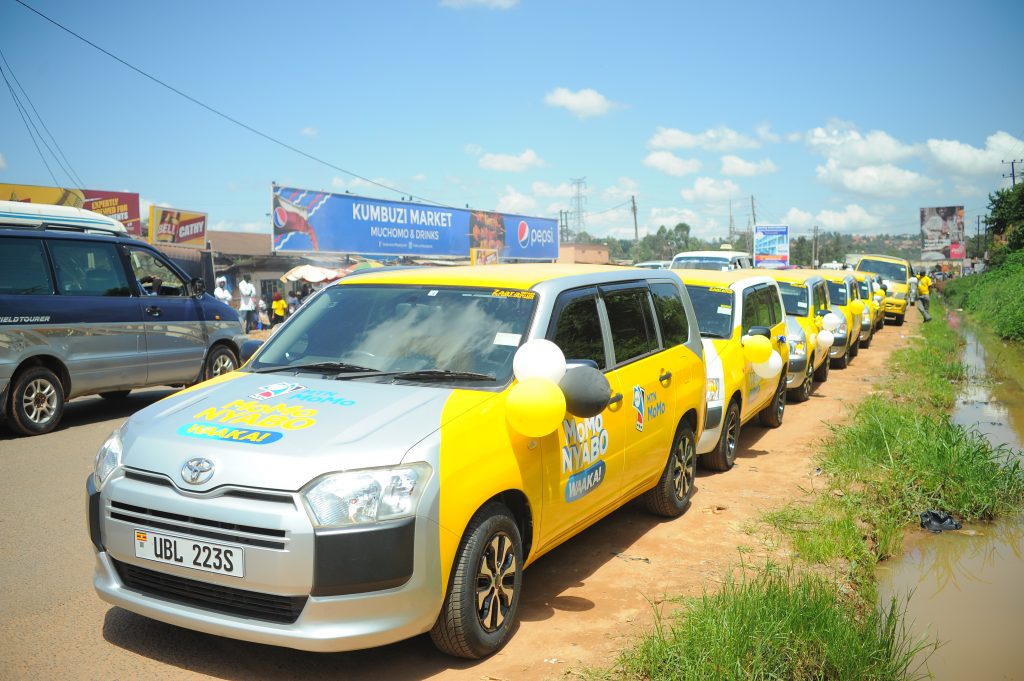 A caravan of the Toyota Succeed cars to be won by MTN customers during the MoMo Nyabo Waaka promotion station at Kumbuzi. 1