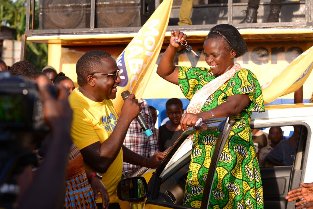 Naluwooza celebrates upon receiving her car