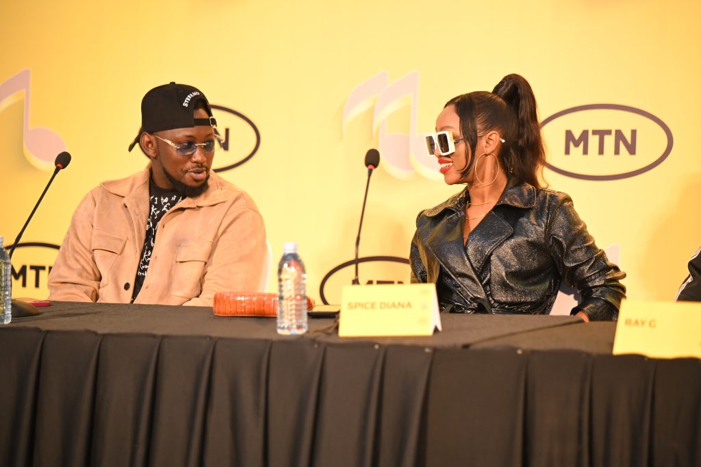 Levixone and Spice Diana having a light moment at the press conference that was held at MTN Head offices yesterday