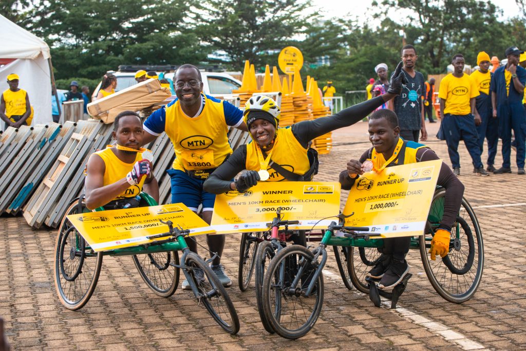 MTN MoMos Stephen Mutana handed over the wheelchair race cheques. The race was held on 13th November 2022.