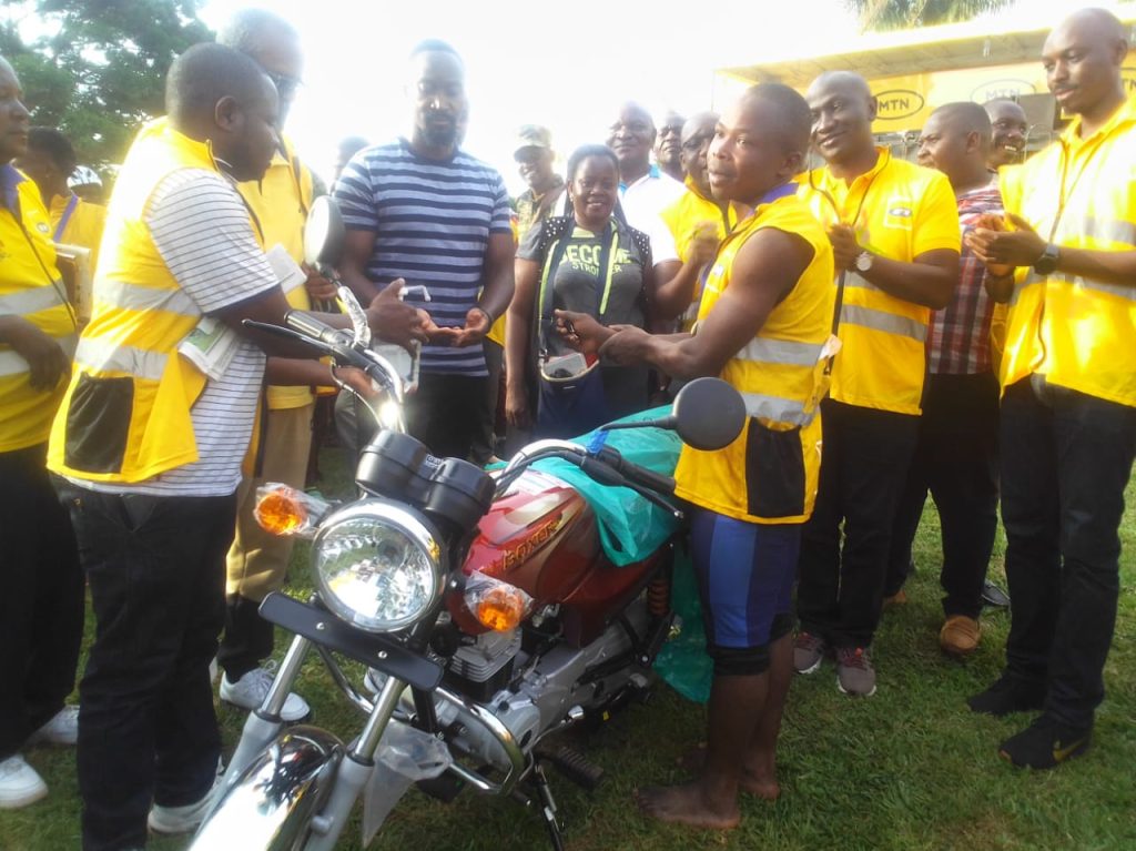 The Kyabazinga prepares to hand over a brand new Bajaj Boxer to the overall winner. Tiffu Luganda. The other winners also walked away with assorted prizes