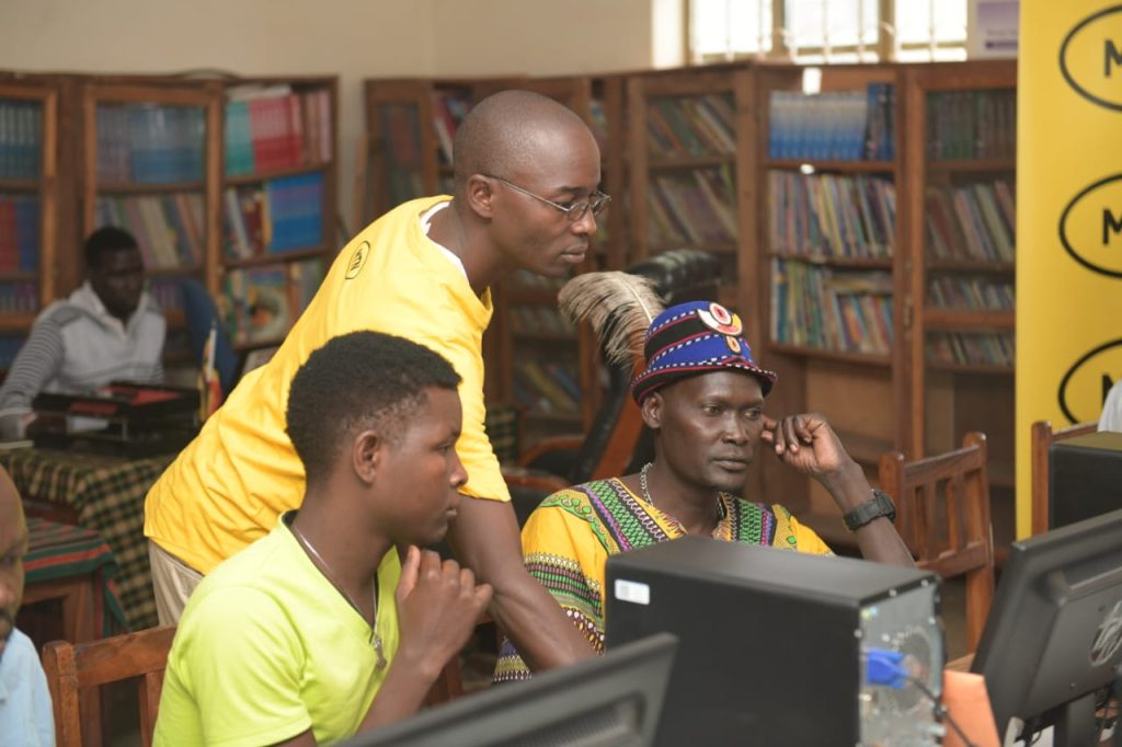 Moroto Public Library users being guided on research in the fully equipped computer lab. 1