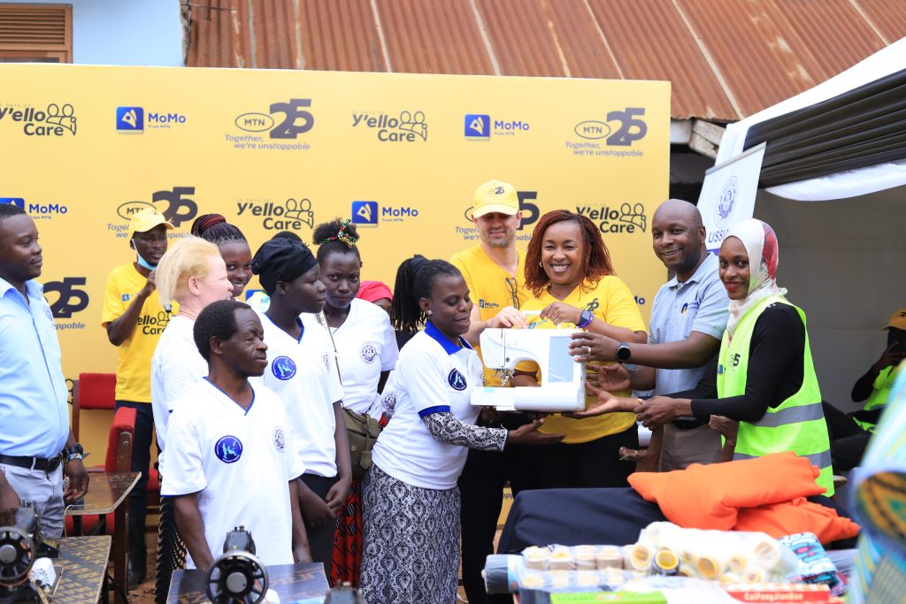 MTN Uganda led by CEO Sylvia Mulineg and partners donate sawing machines to Disability Employment Link Project Uganda located in Bwaise Kampala on the ongoing 21 Days of Yello Care 1