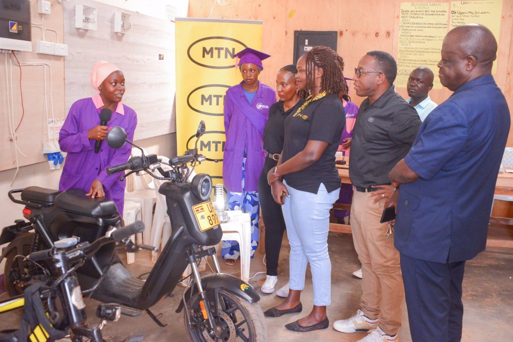 One of the learners at Smart Girls Foundation showcase of their engineering skills to MTN Foundation team and Kasangati Town Council leadership during the MTN Girls in Tech graduation on May 29 2024