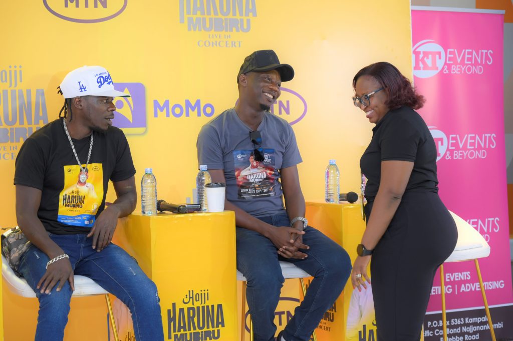 L R Artist Alien Skin and Singer Mesach Semakula chatting with Mavis Ndagire Musungu MTN Ugandas GTM Digital Specialist at the press conference held at MTN Headquarters